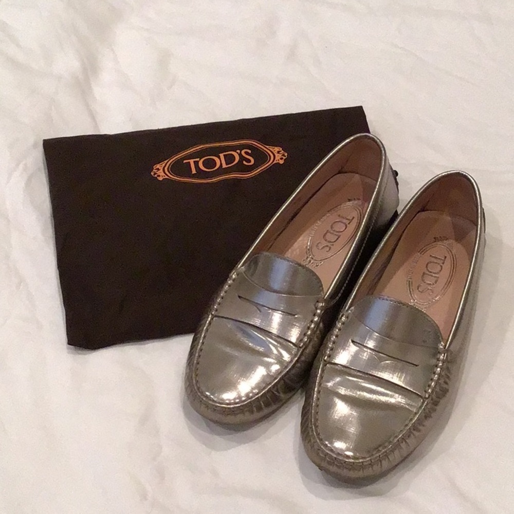 Tod’s Size 5 1/2 silver metallic penny loafers.